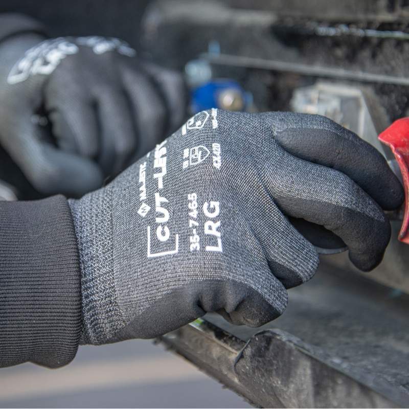Gray and black Cut-Less® Korplex® cut resistant work glove with foam nitrile palm, 18-gauge knit, reinforced thumb crotch, ANSI A4 protection