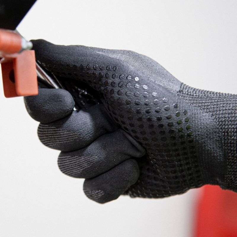 Gray and black Cut-Less® Korplex® cut resistant work glove with nitrile dotted palm, 18-gauge knit, reinforced thumb crotch, ANSI A4 protection
